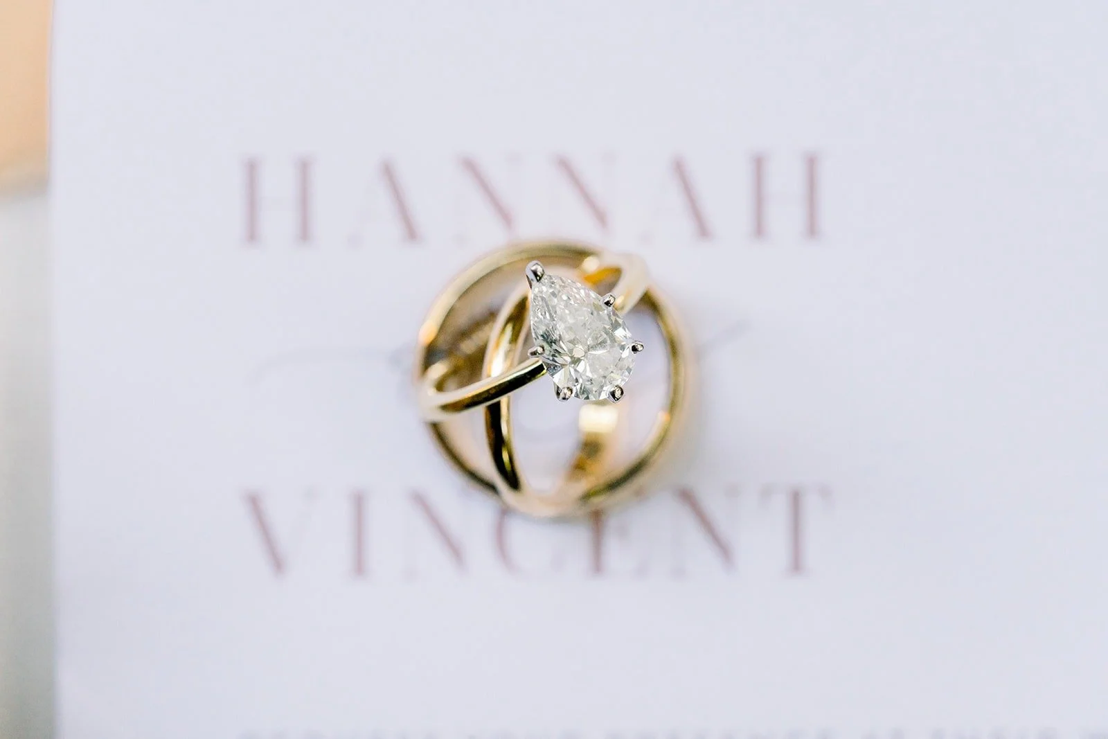 Engagement ring on the invitation printed with Hannah and Vincent's names