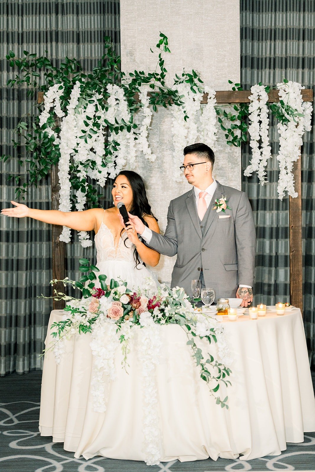 Betsy raises a toast from the sweetheart table