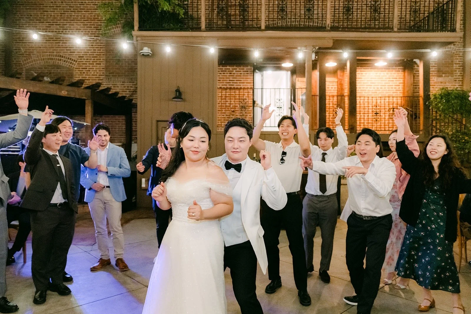 Chorok and Min Soo in the middle of the dance floor with their friends