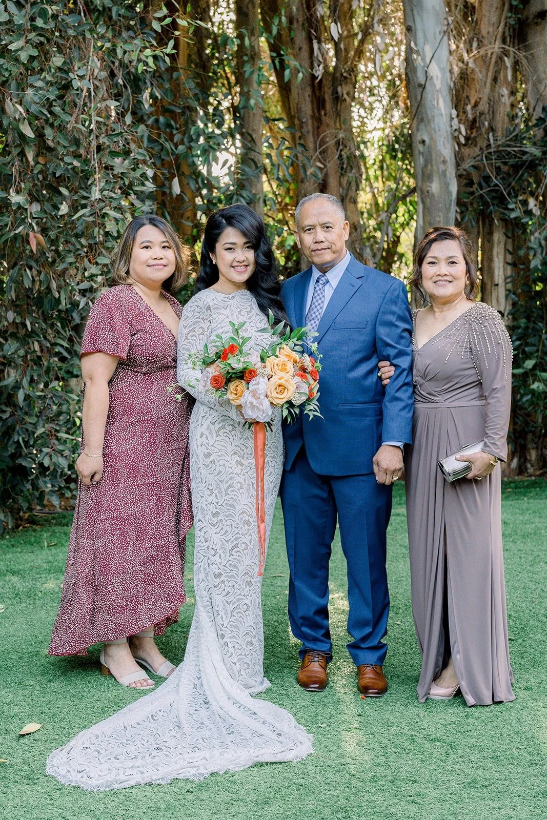 Hannah and Vincent with family members after the ceremony, photographed by One and Only Production