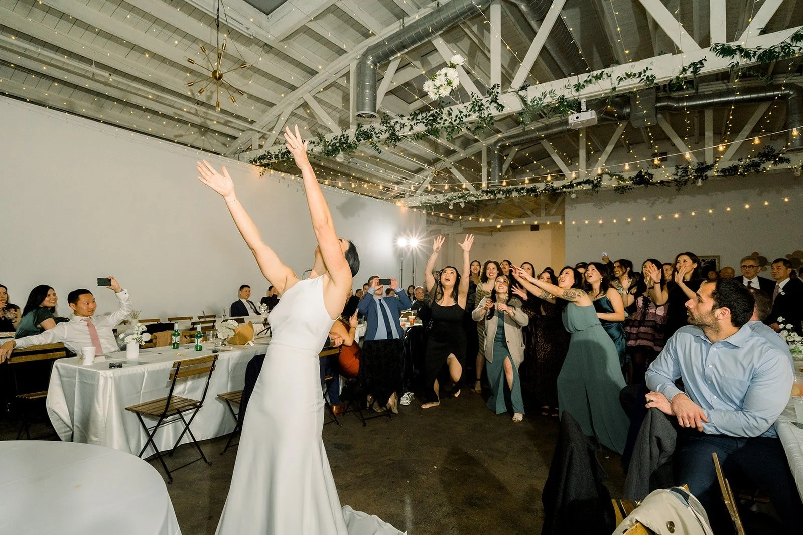 Cindy cheers after the bouquet toss