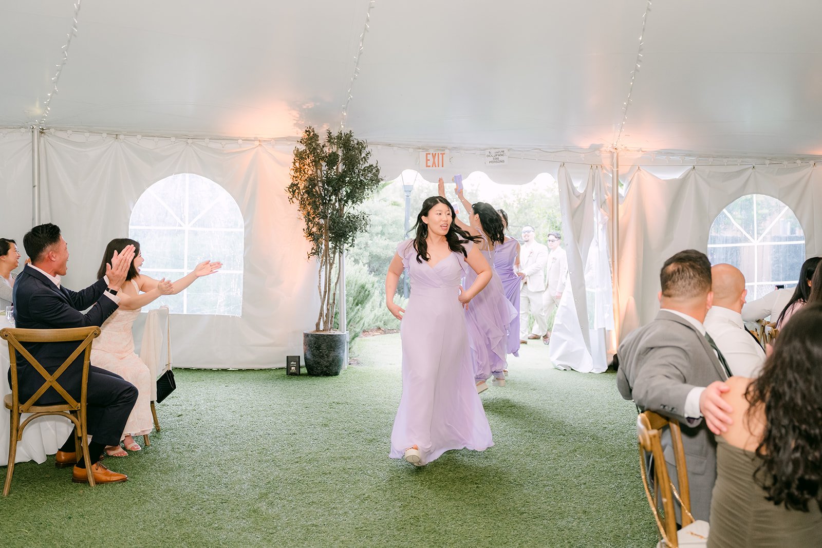 Bridesmaid dancing into the reception for the grand entrance