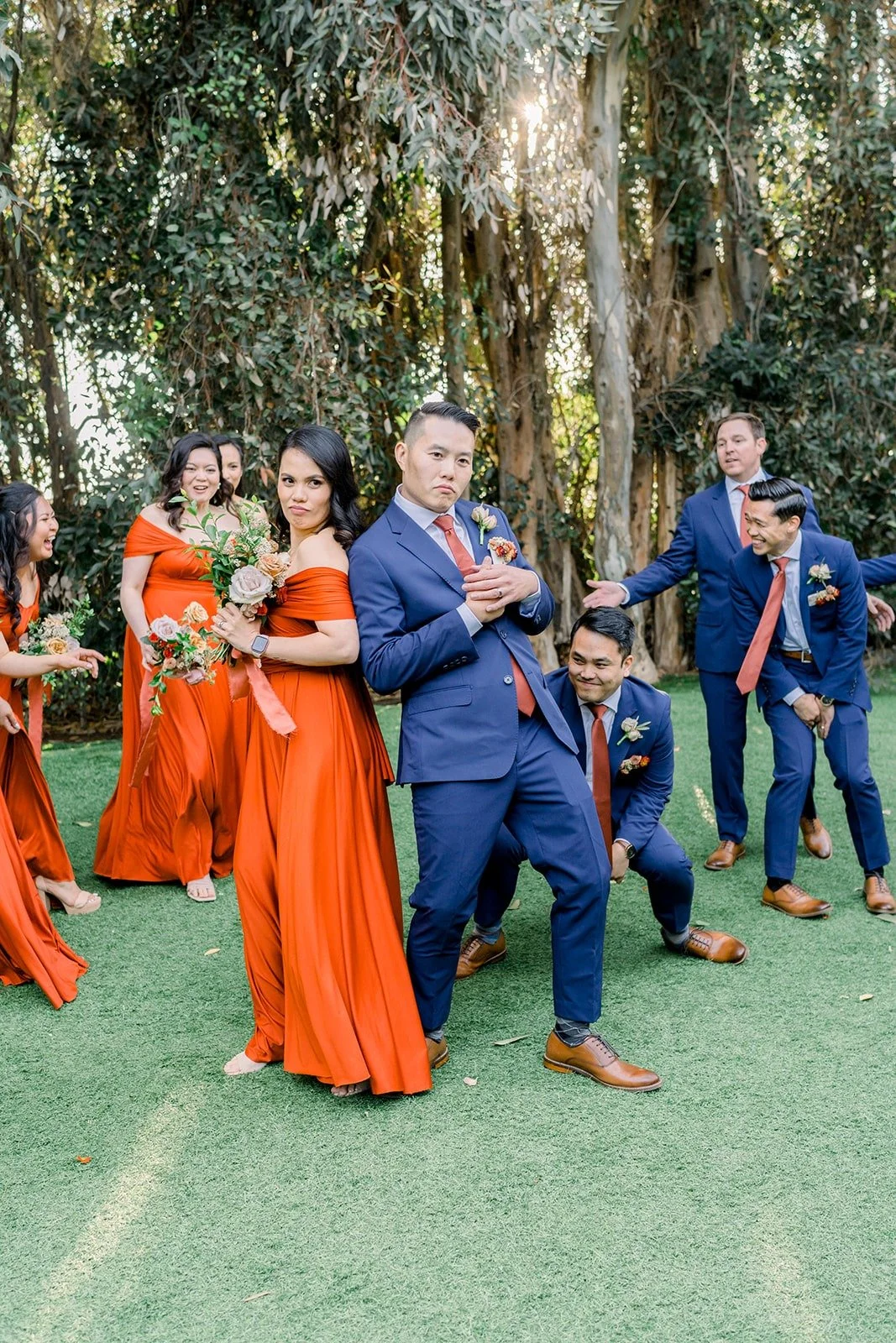 The wedding party dancing on the lawn