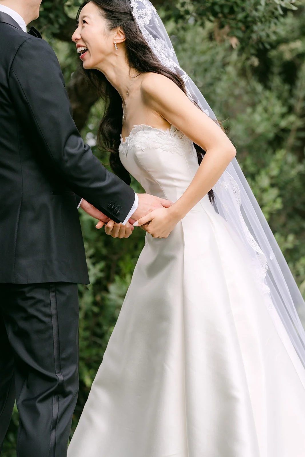 Kristine laughing as William takes her hands
