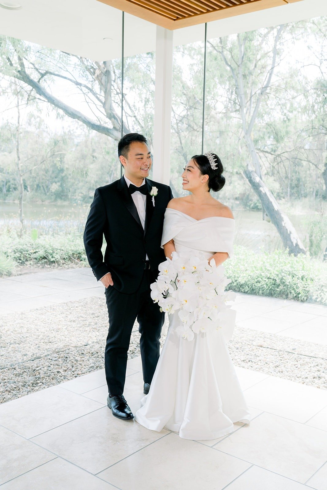 Steven and Jacinda under the wood slat canopy