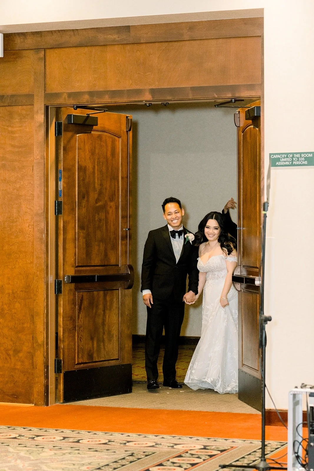 Francesca and Ralph stepping through the wooden doors for their grand entrance