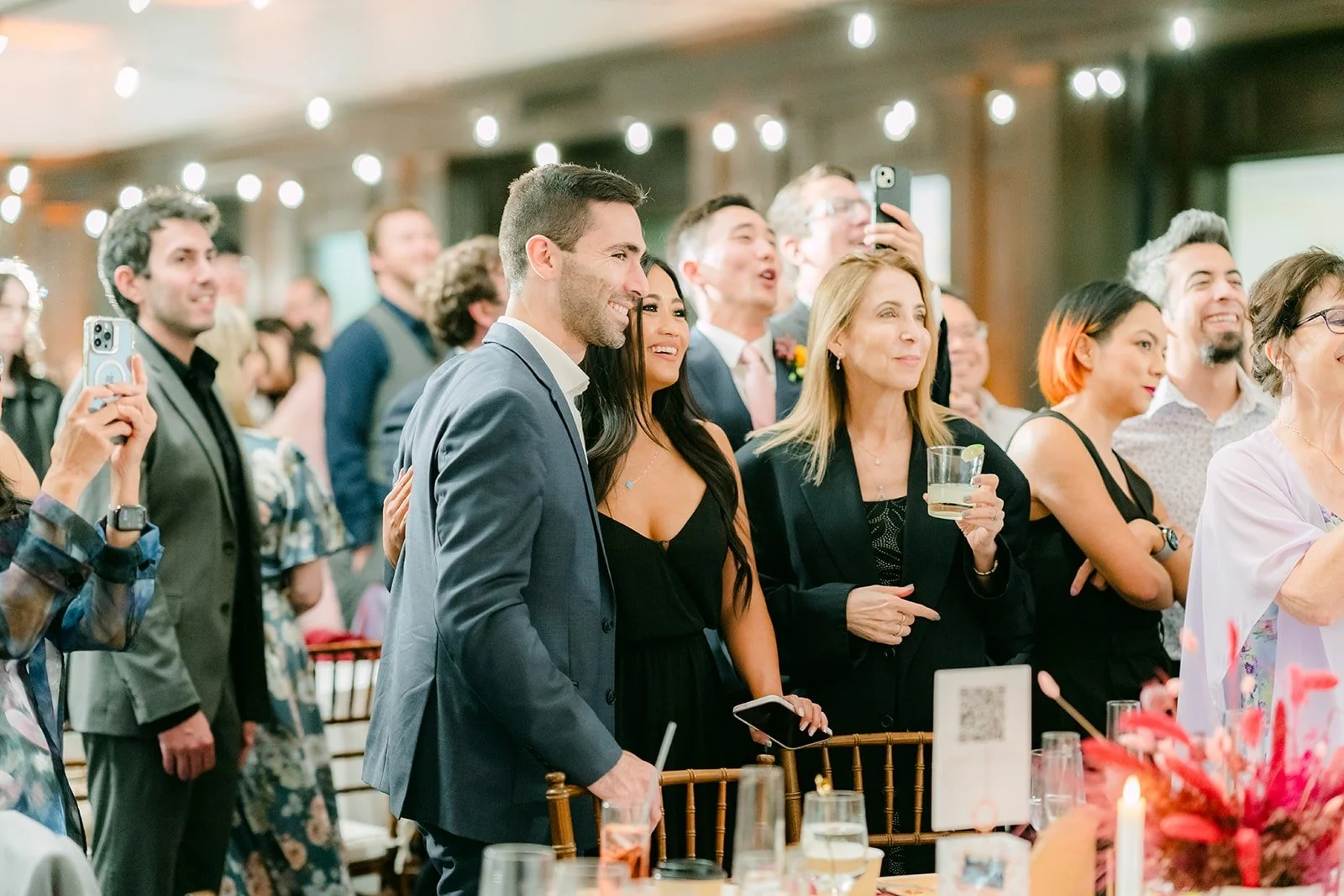 Guests cheering at the cake cutting