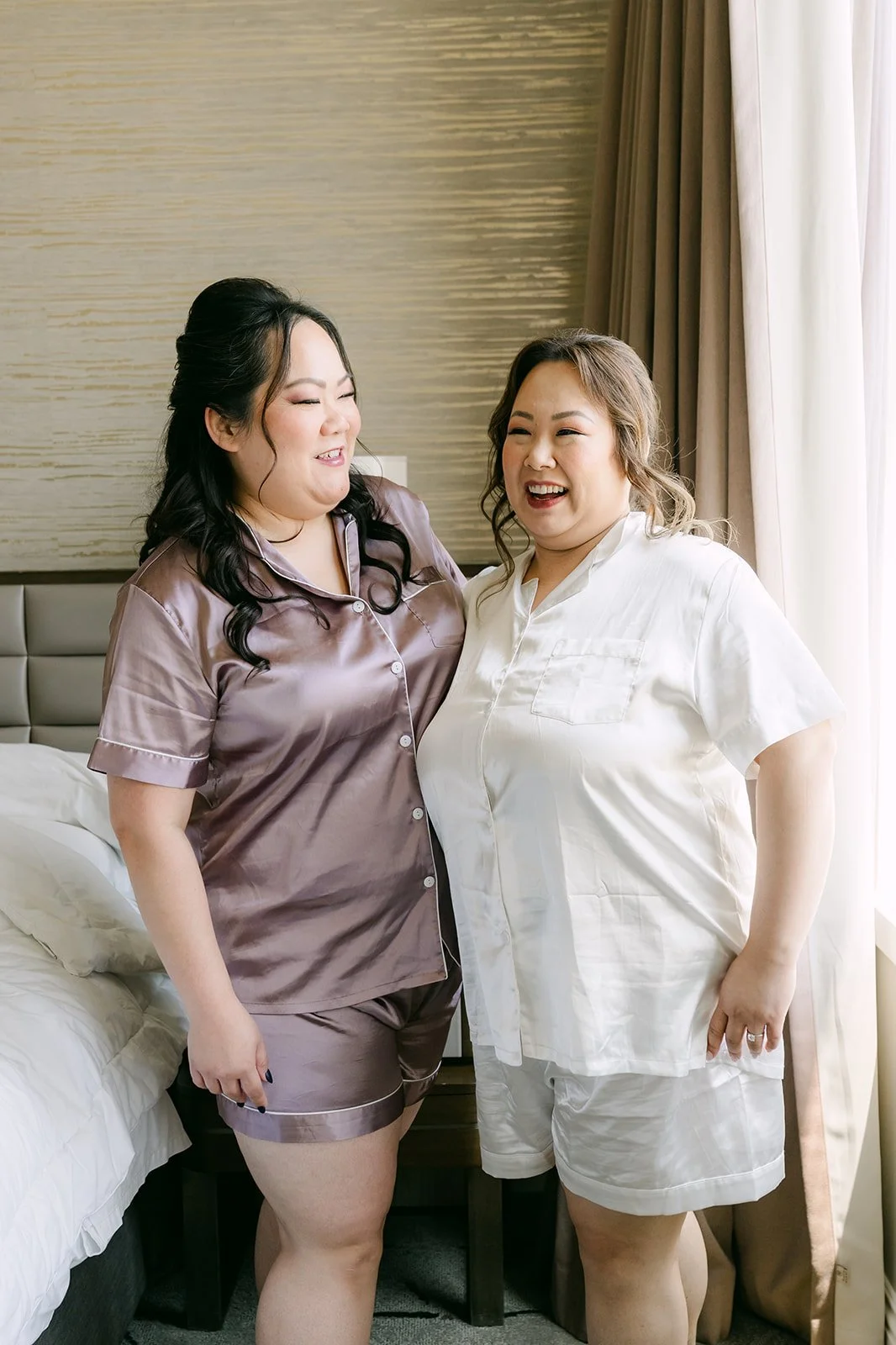 Mai and a bridesmaid in matching pajamas.