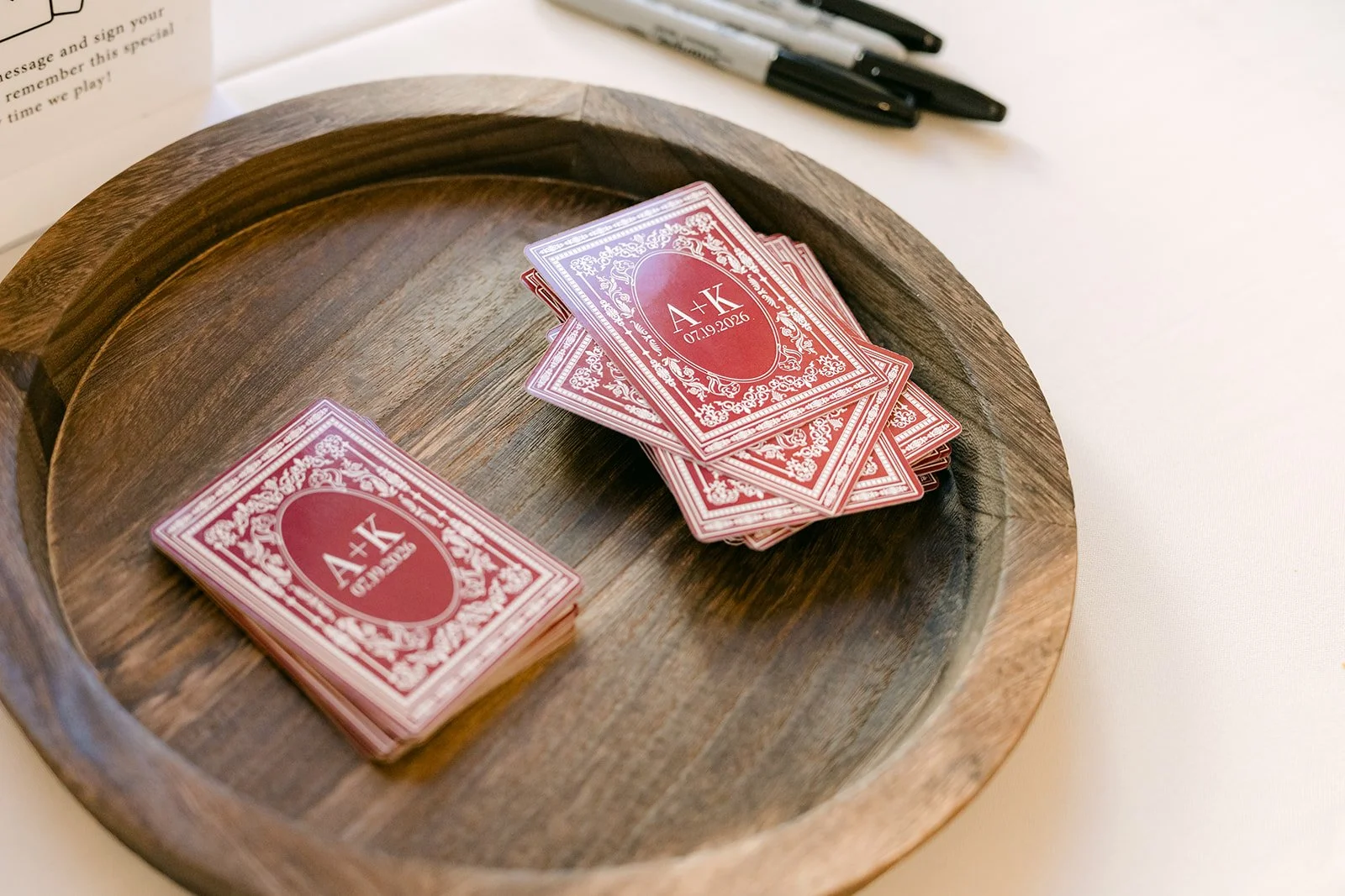 Deck of cards guestbook on a wooden tray