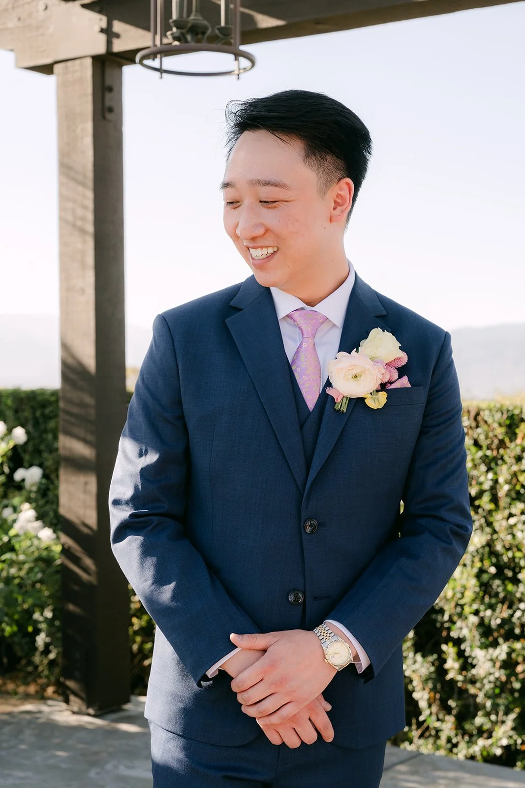 Elijah smiling as he waits at the altar.