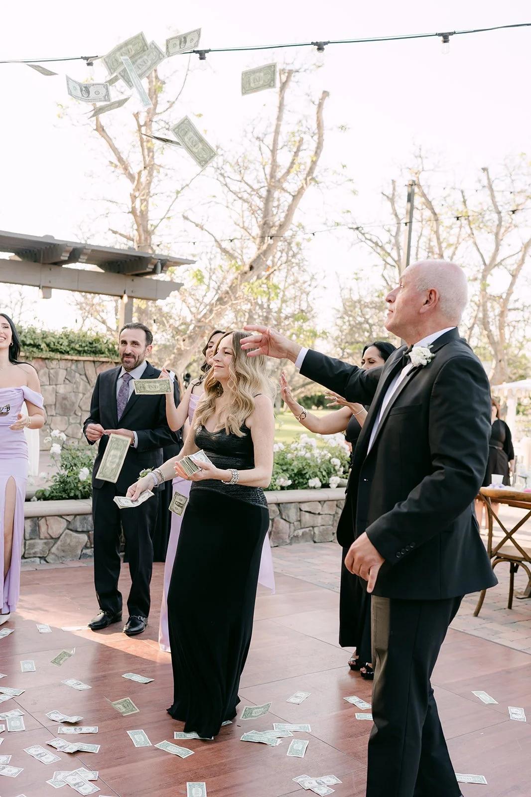 Guests showering the couple with money during the Armenian tradition