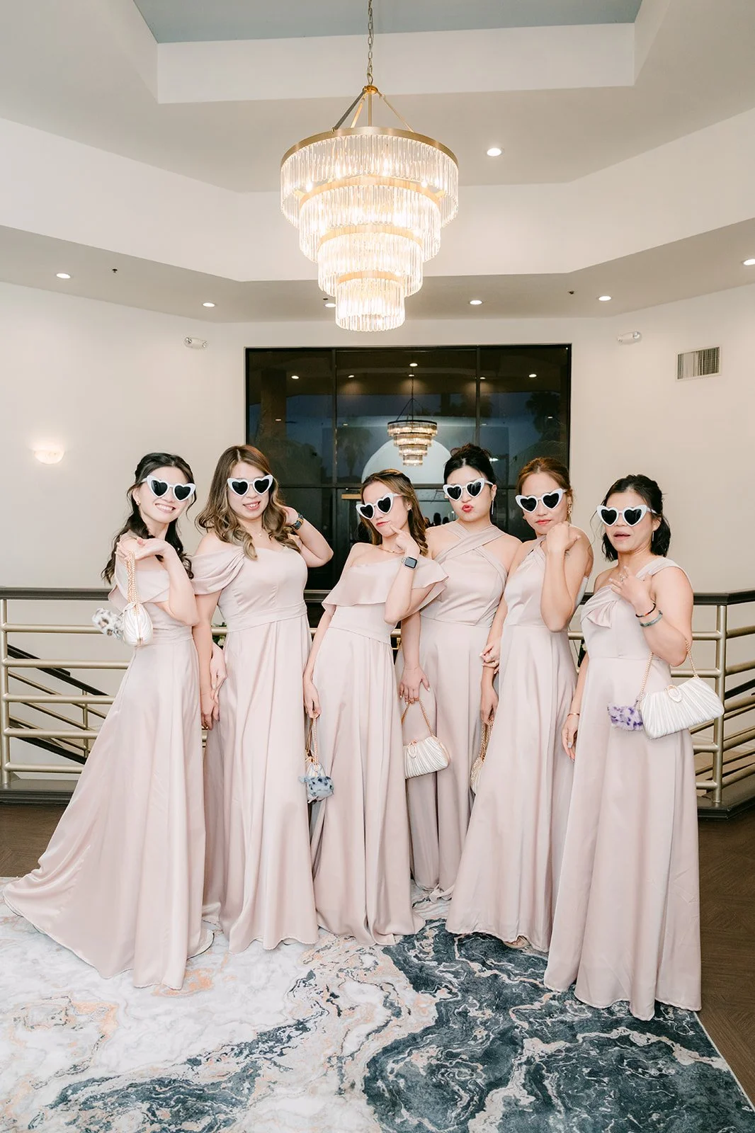 Kate's bridesmaids making their entrance in sunglasses.