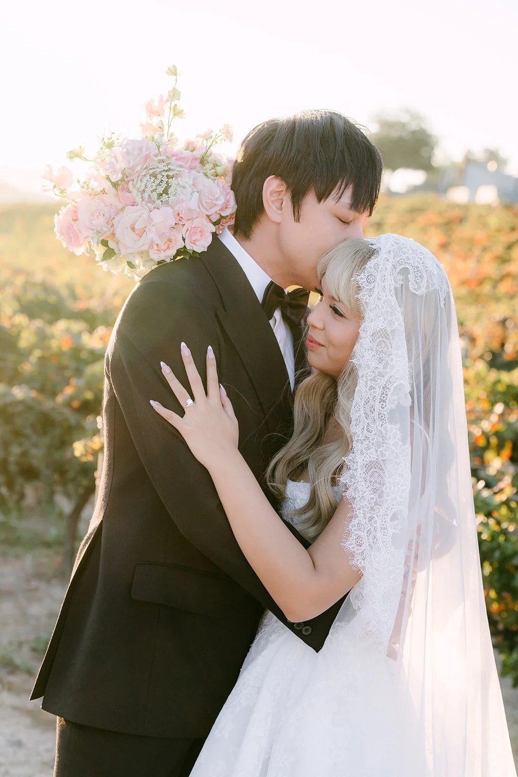 Job kissing Konitha's forehead as she hugs him close