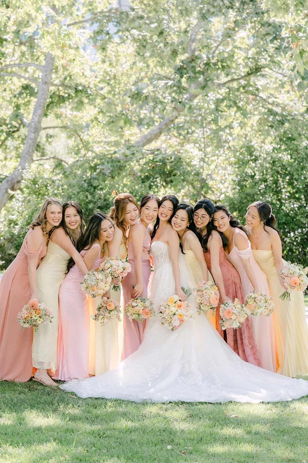 Clarissa and her bridesmaids in blush, butter yellow and mauve