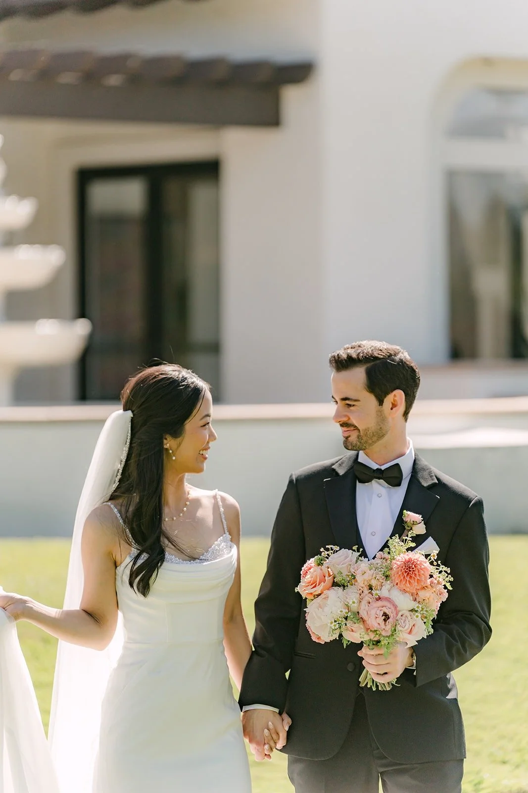 Stephanie and Kevin laughing together in front of the venue