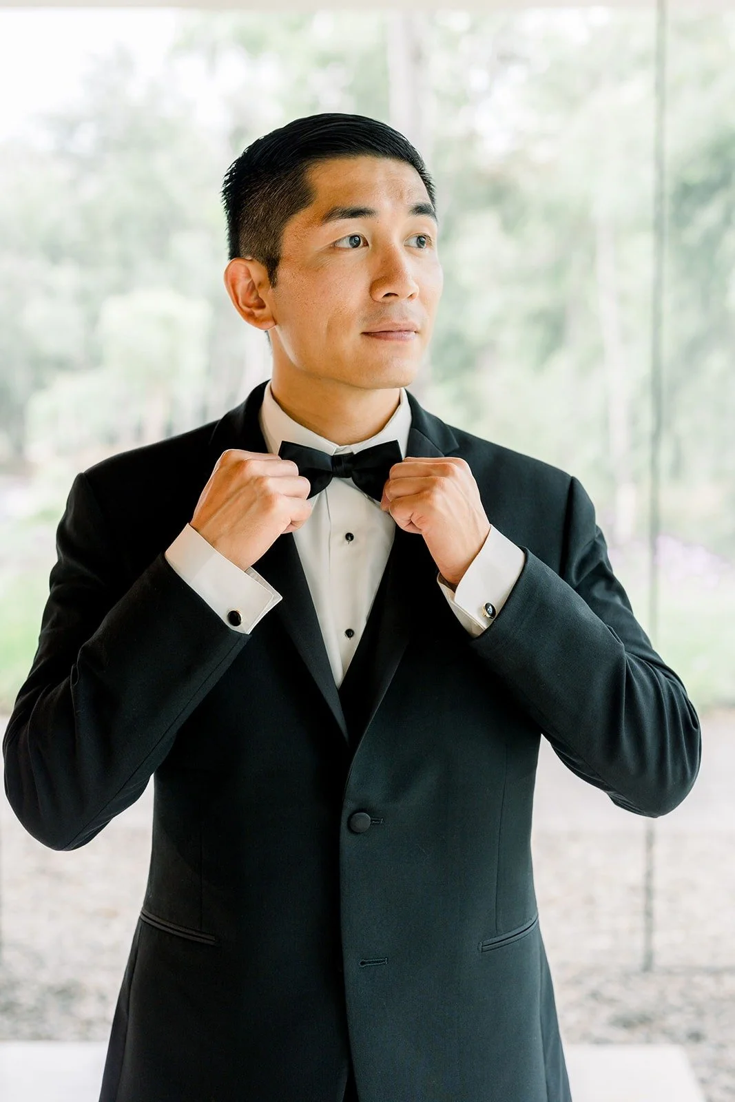 Steven adjusts his bow tie