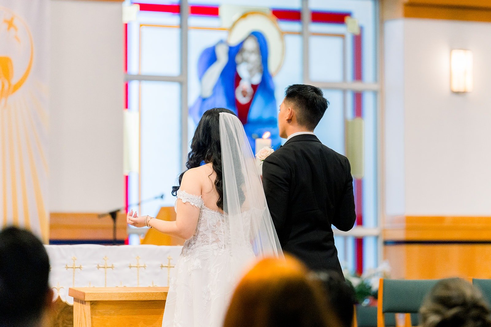 Francesca and Ralph walking up the altar steps together