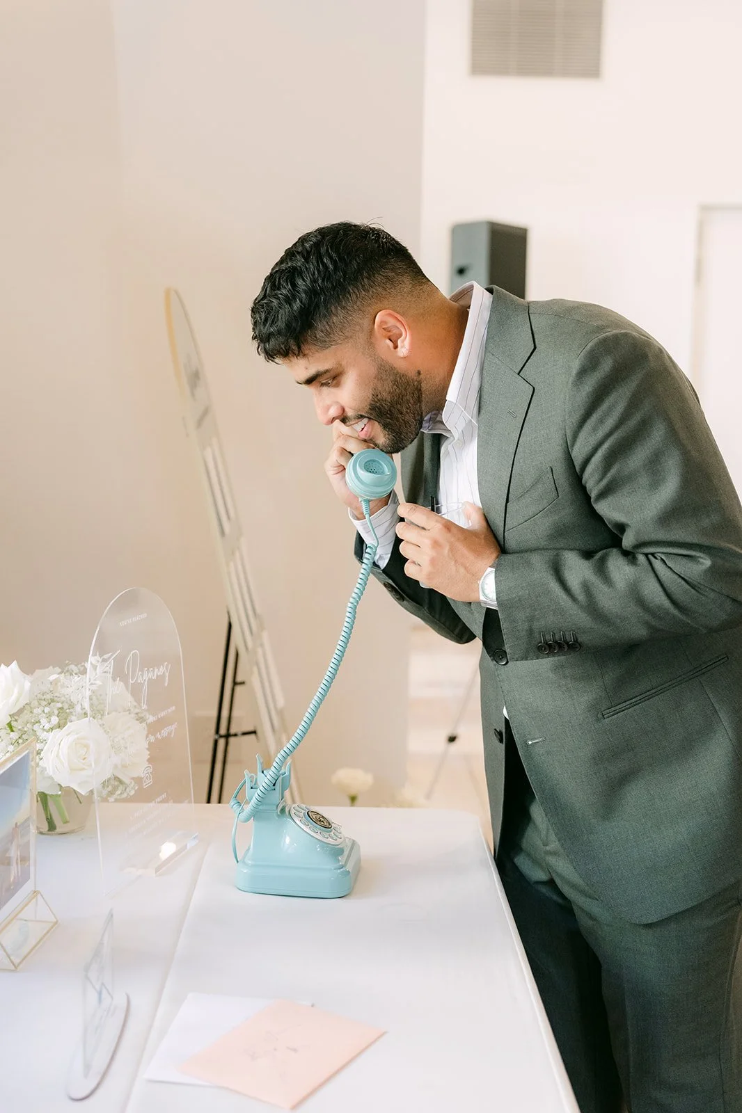 Guest leaving a message on the vintage audio guest book phone
