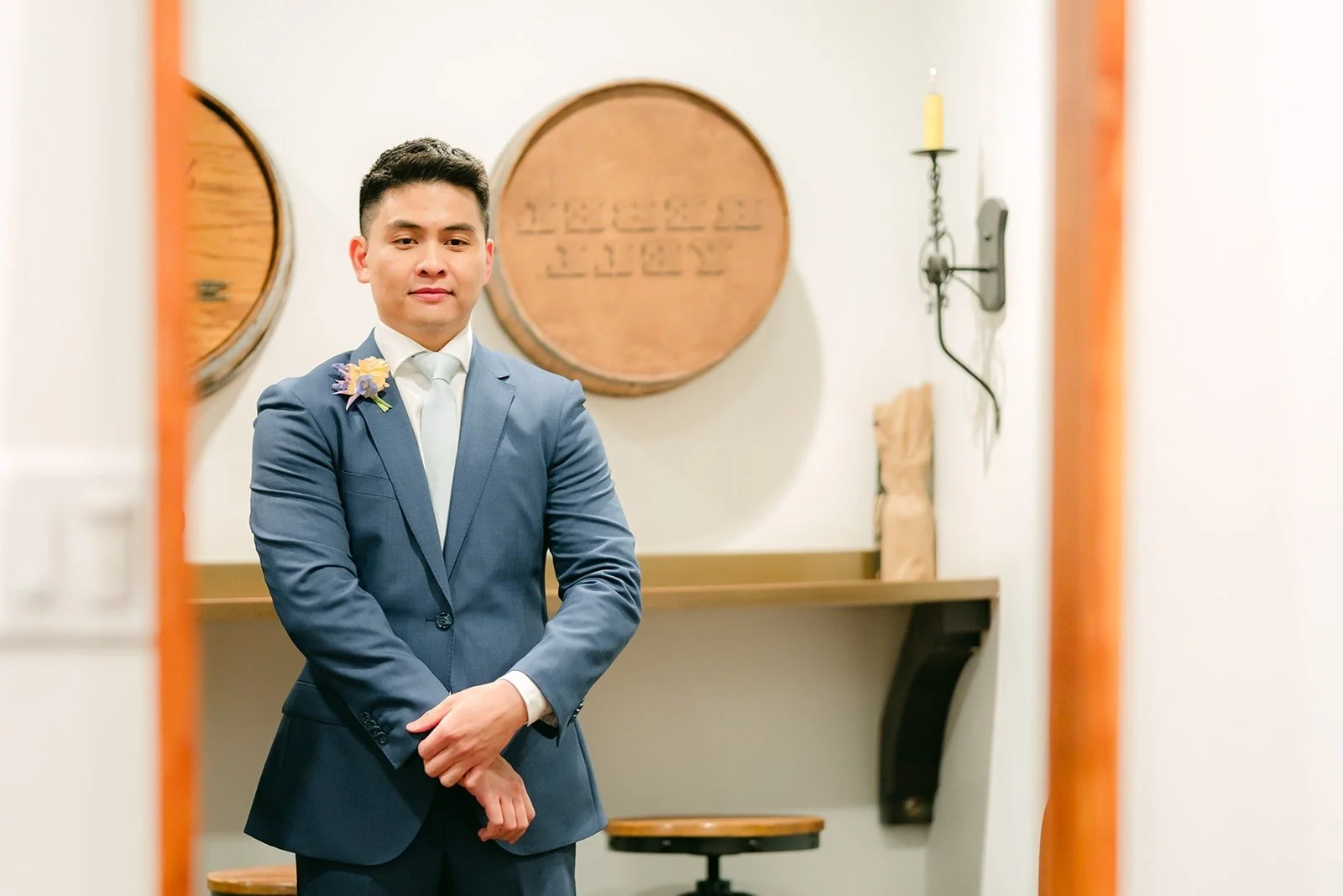 Jerrick in his blue suit in the groom's suite