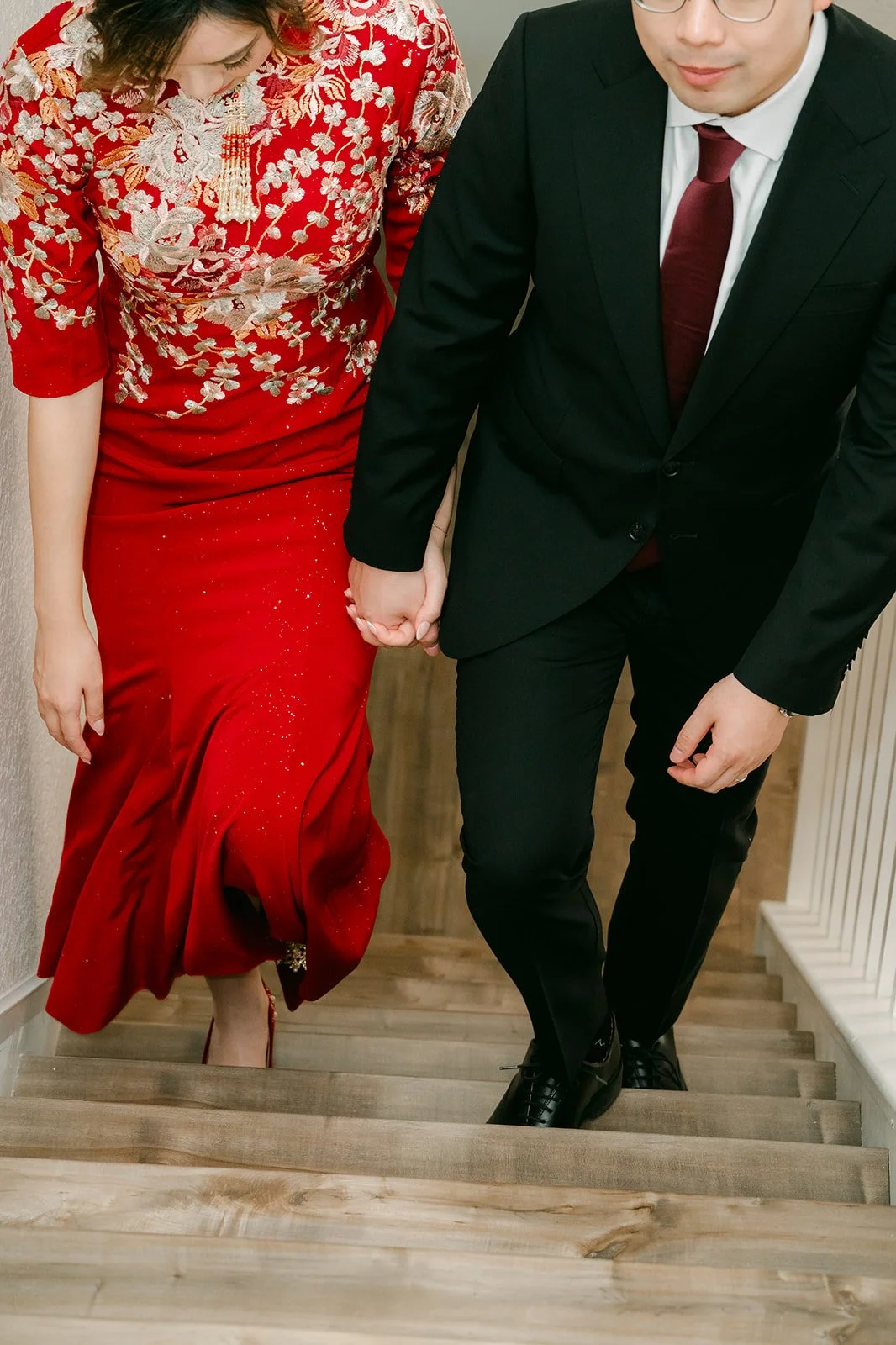 Pauline and Ken walking down the stairs.