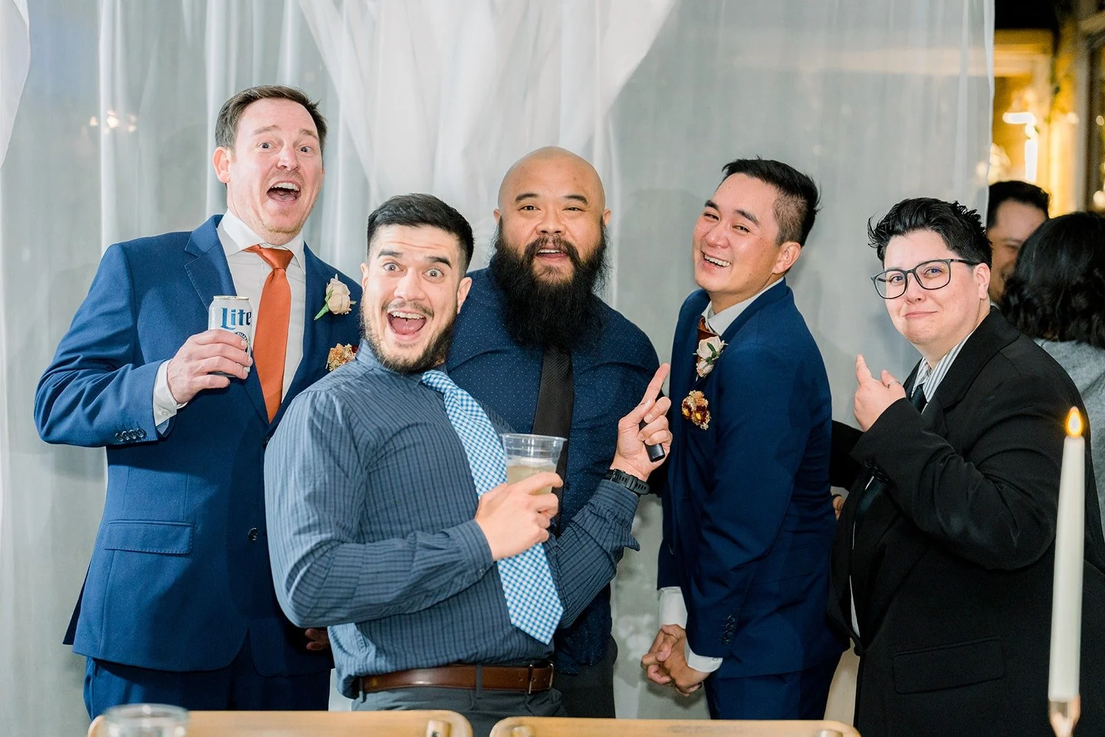 Groomsmen celebrating on the dance floor