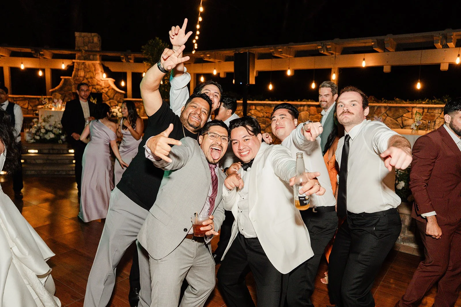 Wedding guests posing on the dance floor at The Walnut Grove
