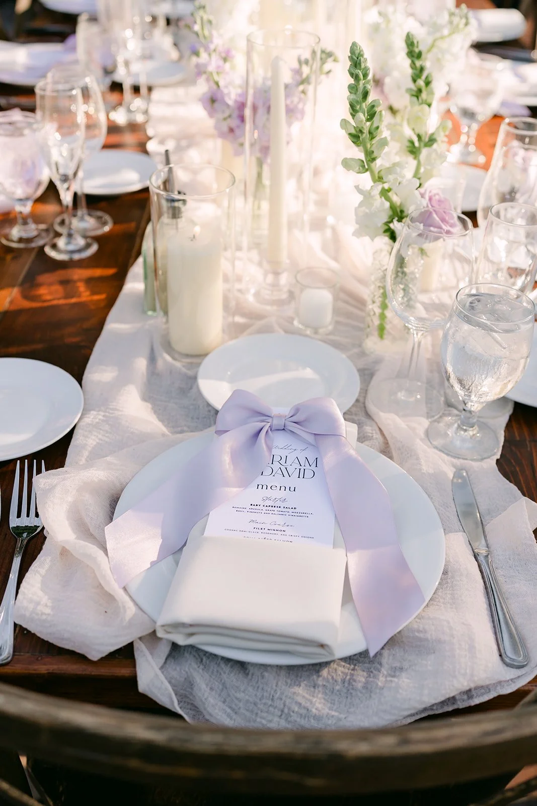 Place setting with lavender napkin and bow tied menu