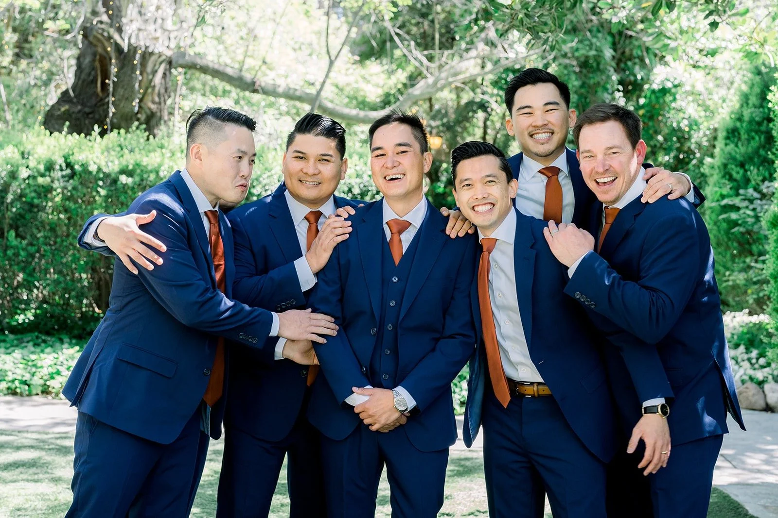 Vincent and his groomsmen joking around in the garden