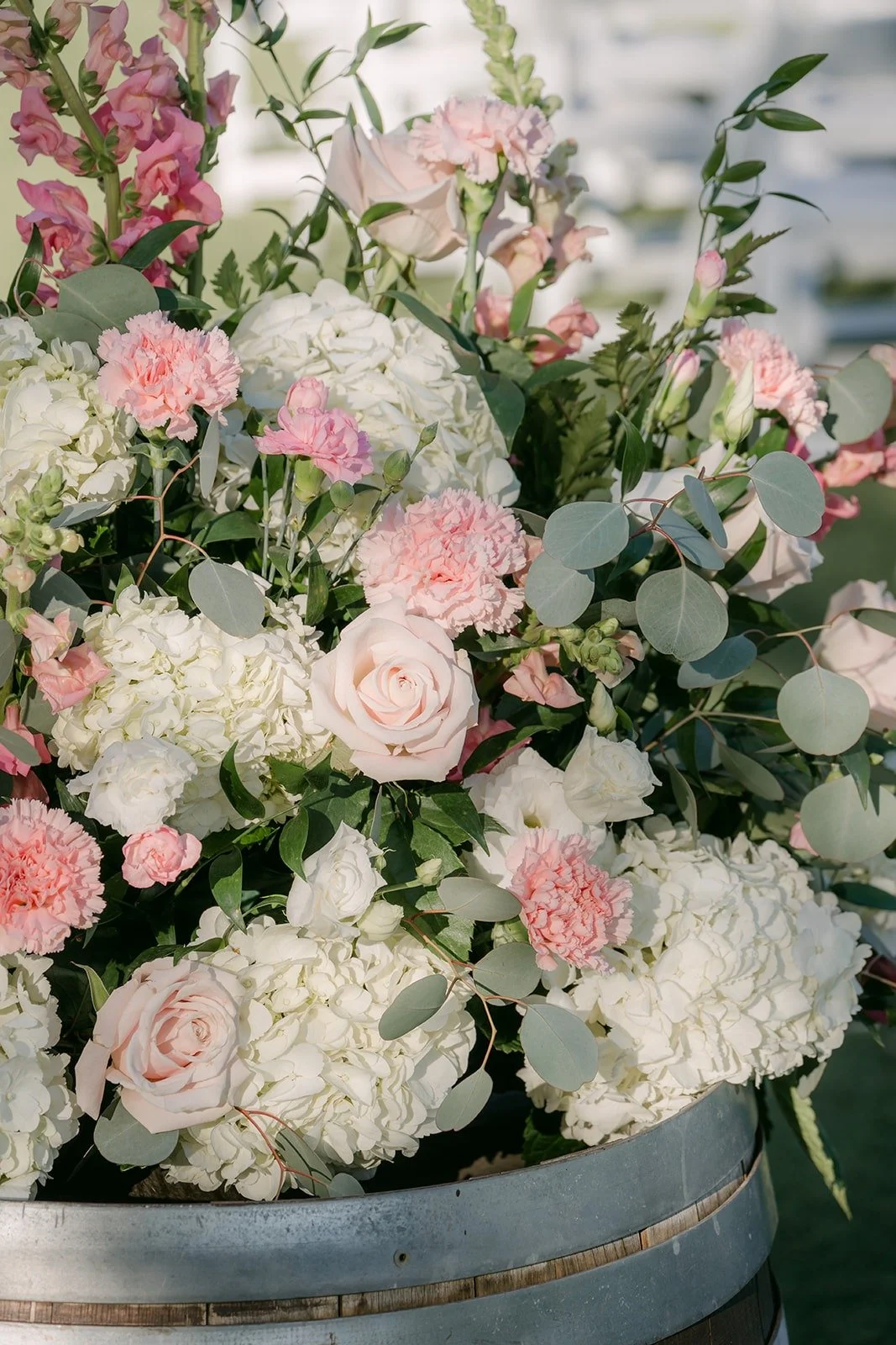 Blush and ivory roses and hydrangeas lining the aisle