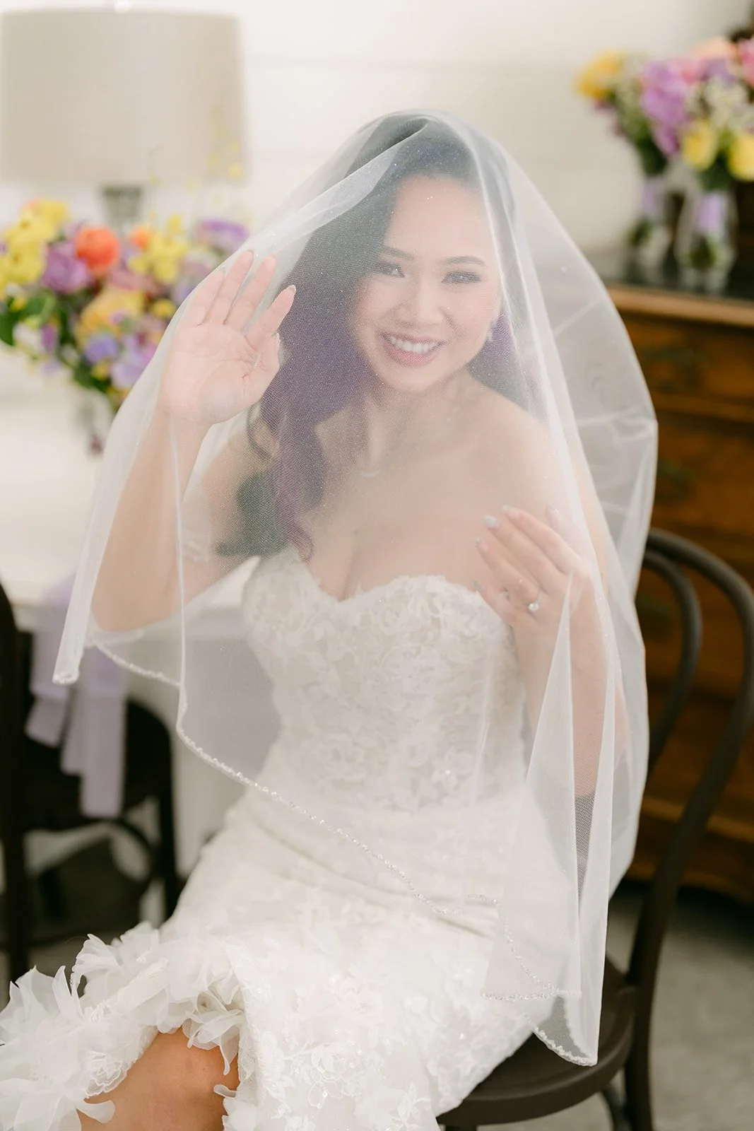 Vannie smiling under her veil.
