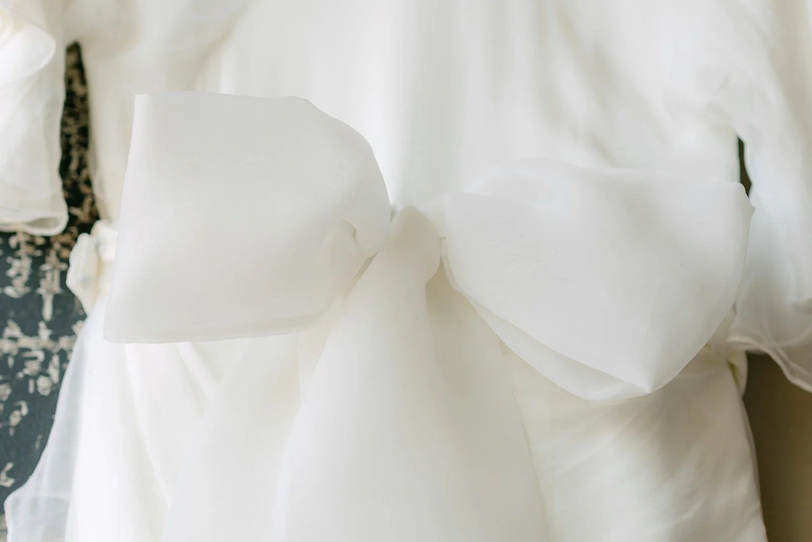 Close up of the bow at the back of Jessie's dress