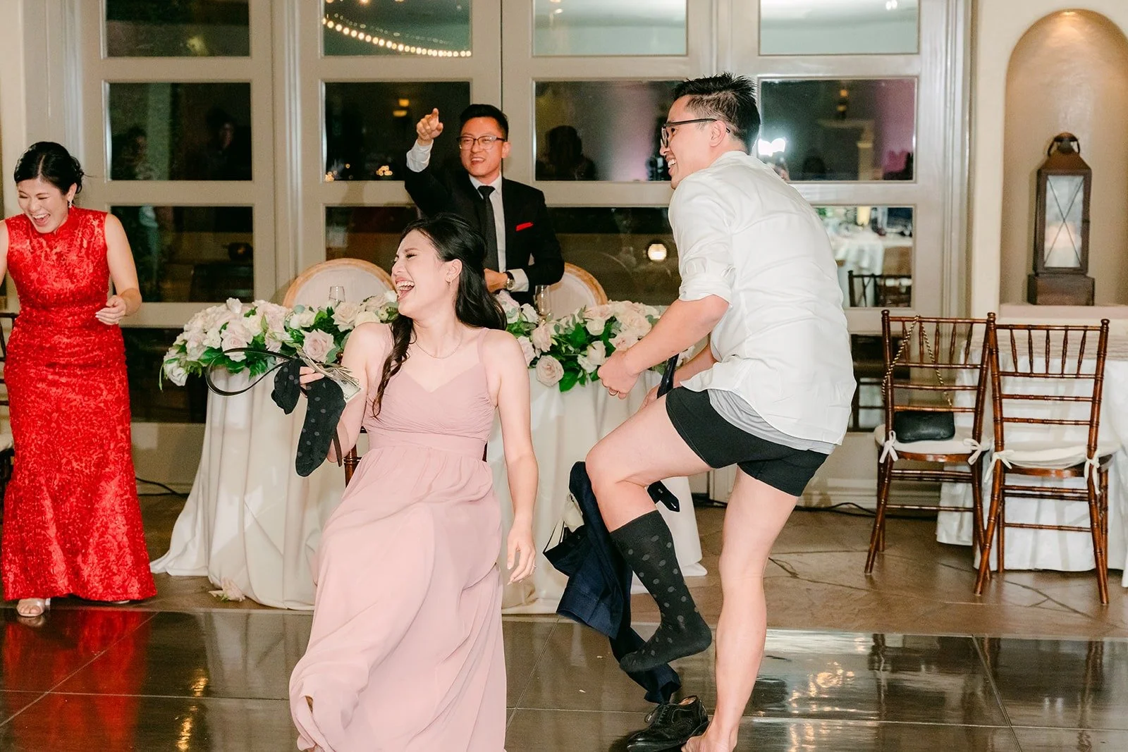 Bridesmaids and guests dancing together