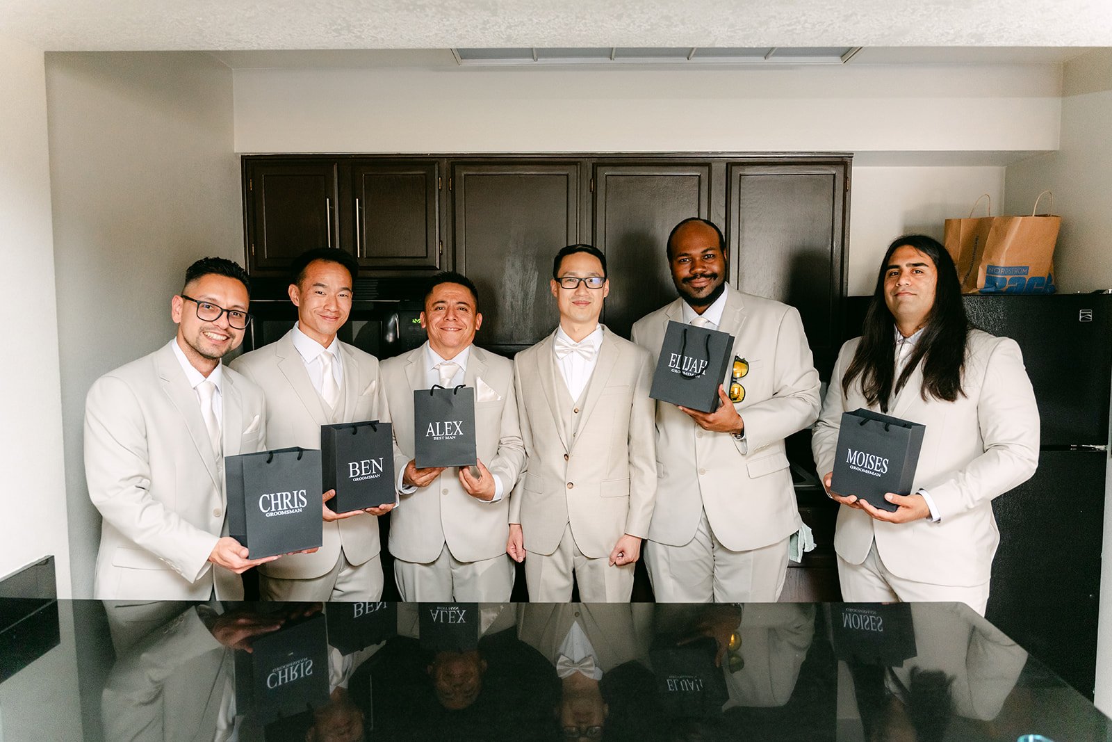 Kevin's groomsmen opening their gifts.