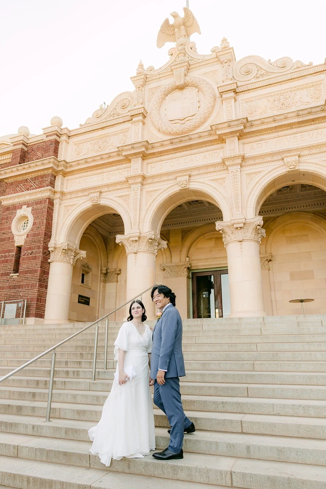 Jessie and Philip on the grand front steps of the Natural History Museum