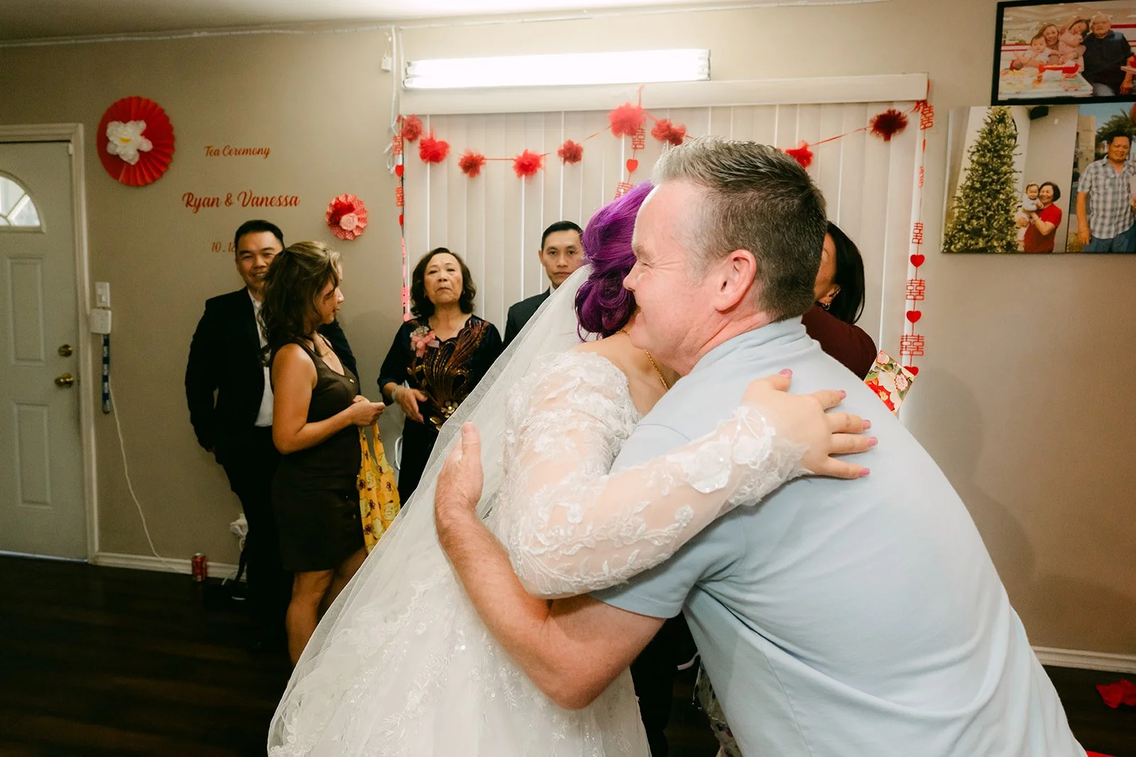 Vanessa hugging a cousin after the tea ceremony, photographed by One and Only Production.