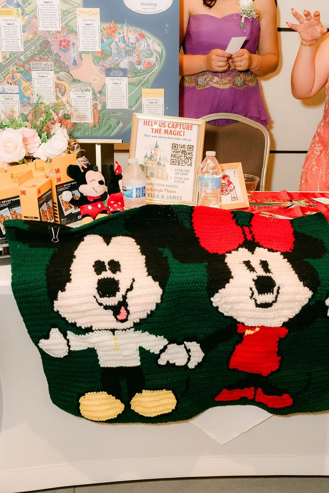 A Mickey and Minnie blanket draped over the gift table