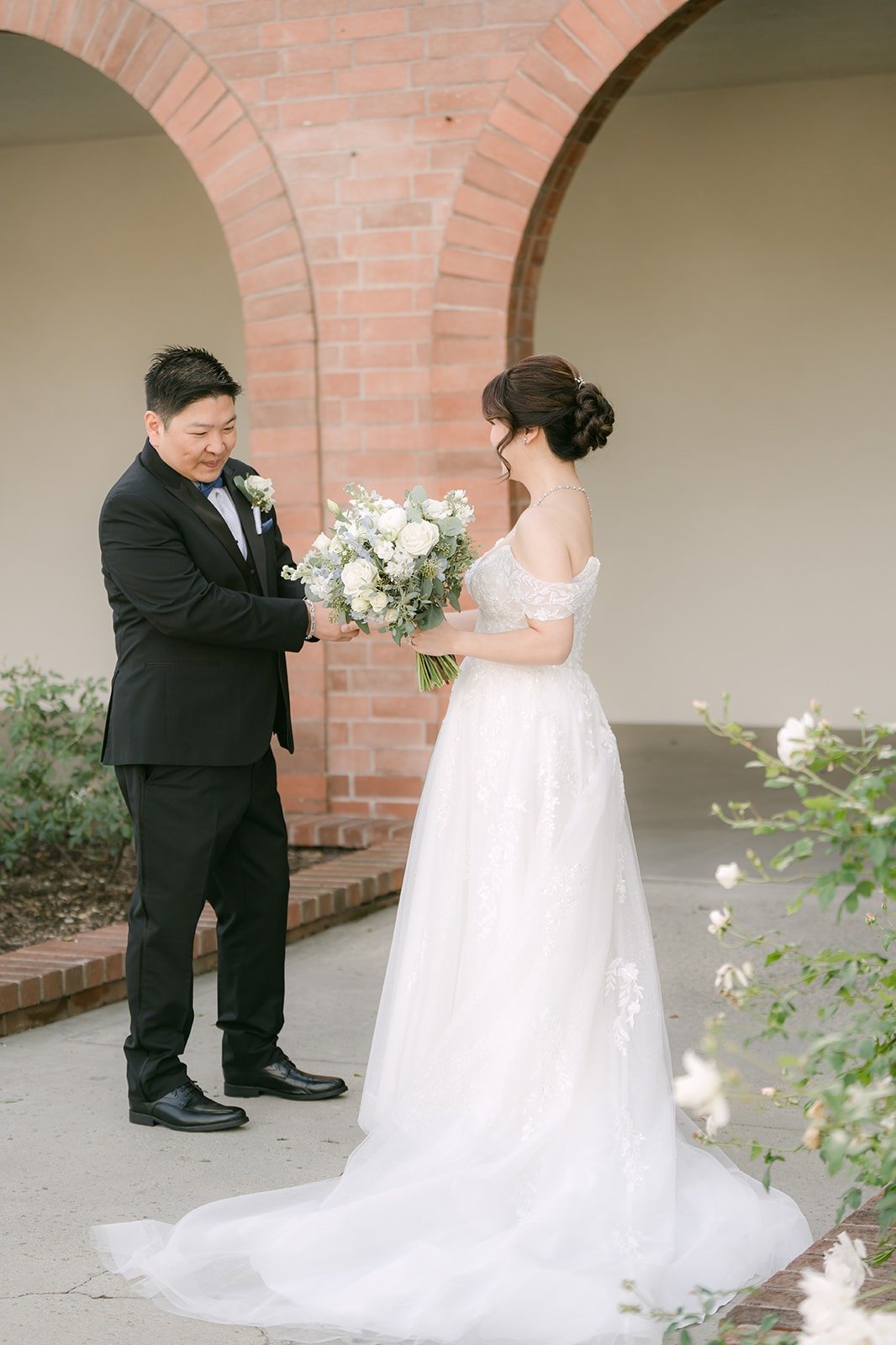 Sochi and Jay in the covered walkway after the first look