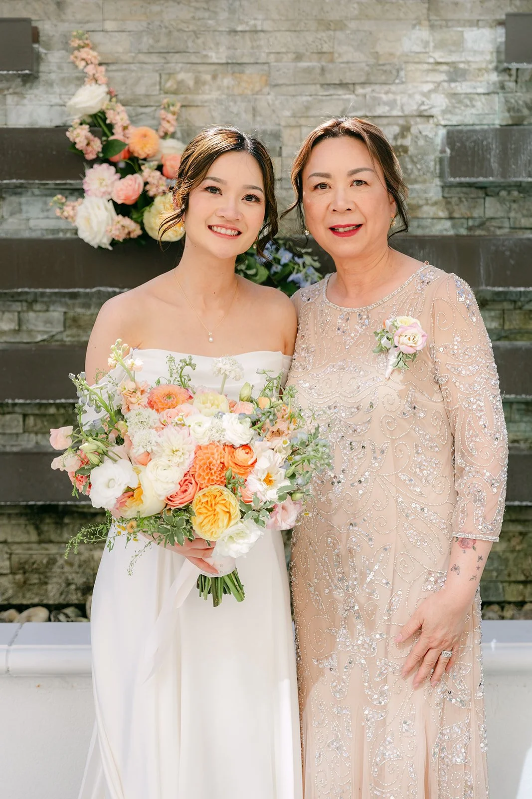 Amanda with a family member holding her bouquet.