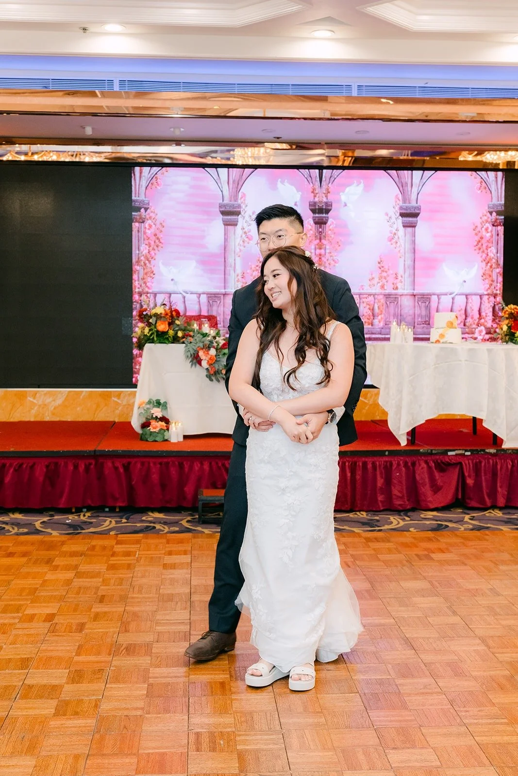 Shayna and Robert hold each other close on the dance floor