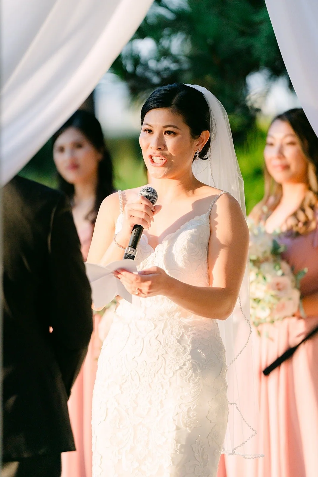 Xuemin reading her vows into the microphone