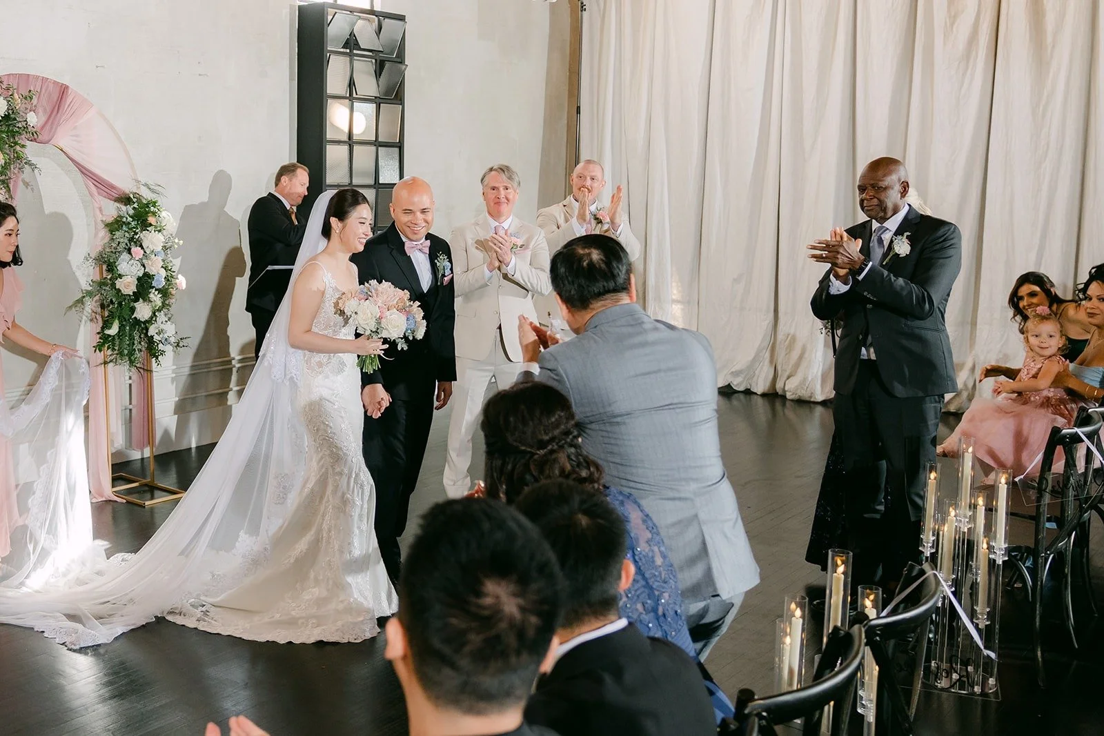 Guests cheer as Elisa and Brandon are married, photographed by One and Only Production