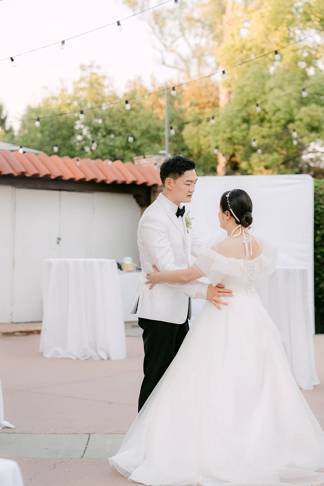 Amy and Sam sharing their first dance on the Adella Lawn