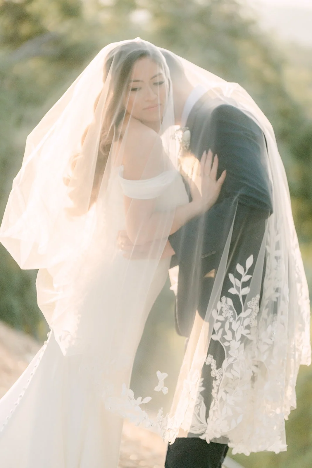 Mariana and Danny wrapped in her lace edged veil