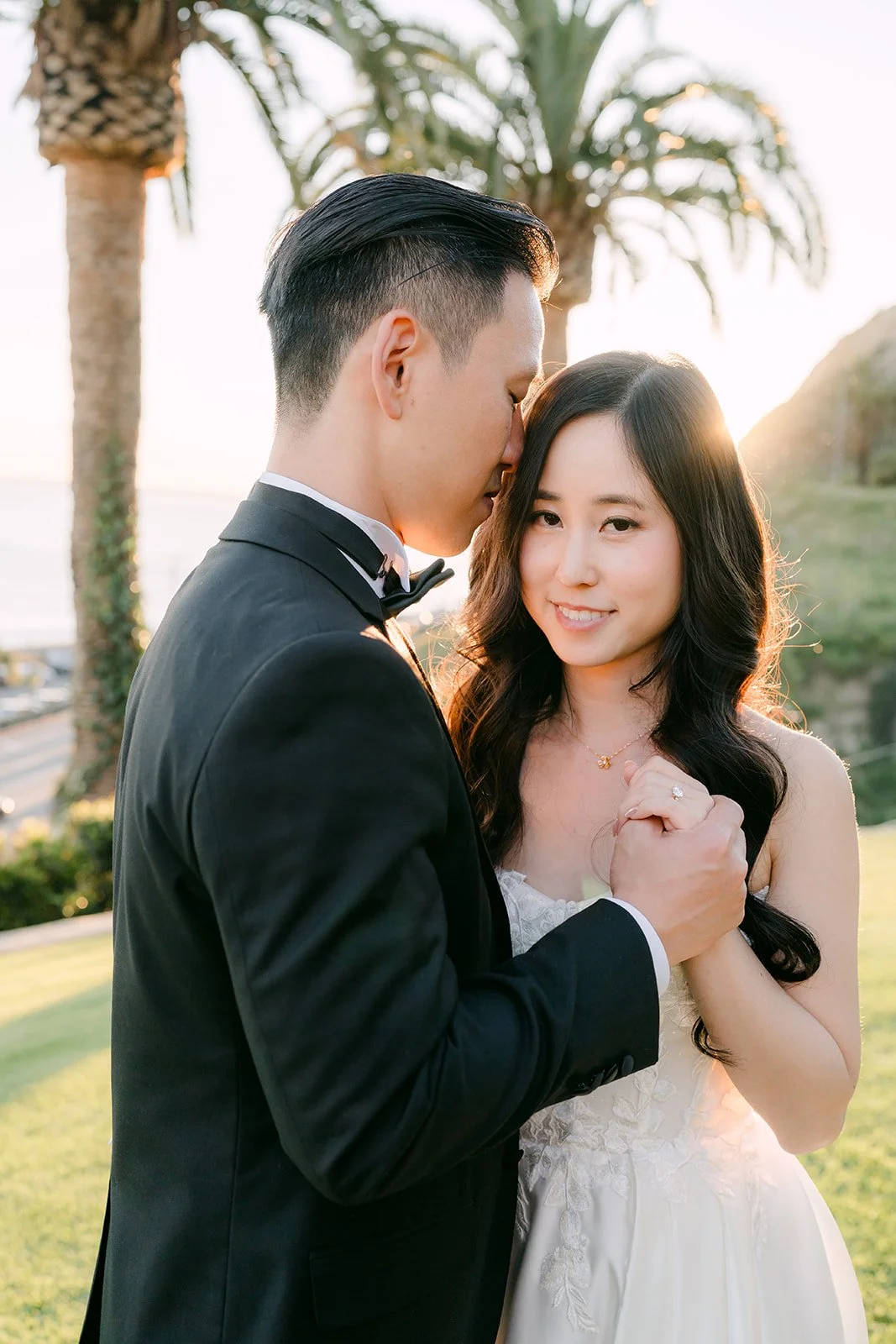 Kai embracing Kelley in golden hour light
