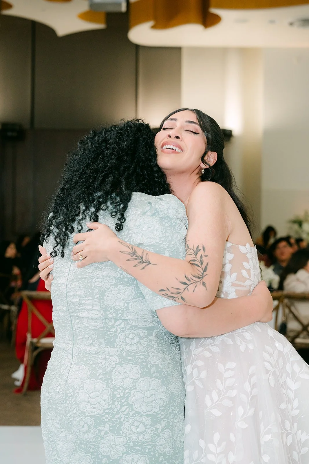 Fernanda sharing a hug on the dance floor.