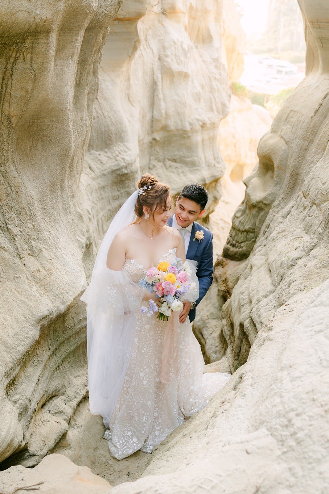 Joanna and Jerrick close together inside the carved sandstone walls