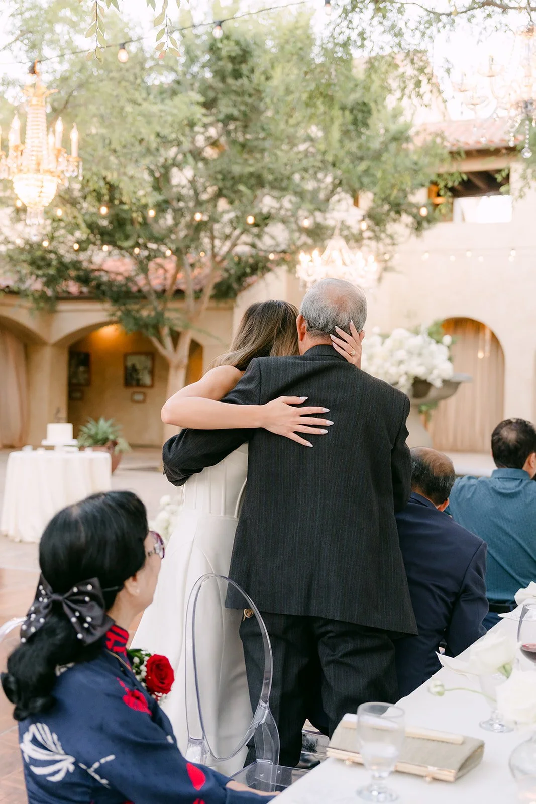 Kieu hugging her father after their dance