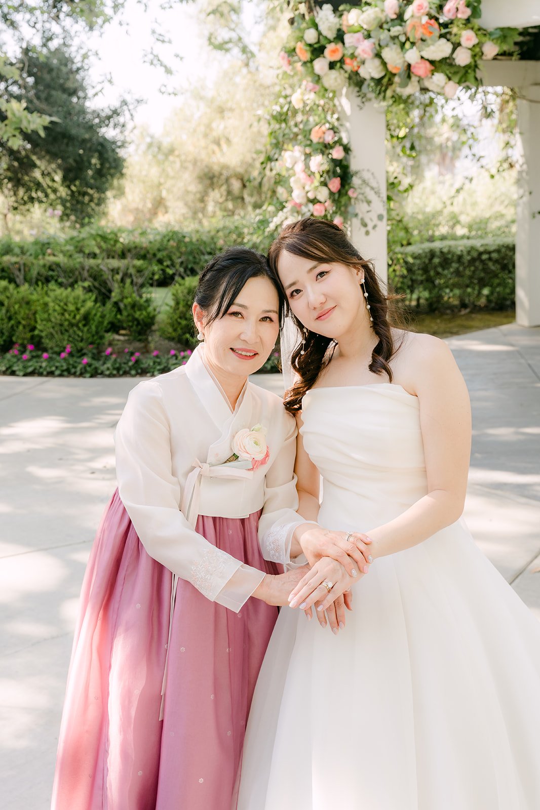 Judy with a guest in a pink hanbok, photographed by One and Only Production