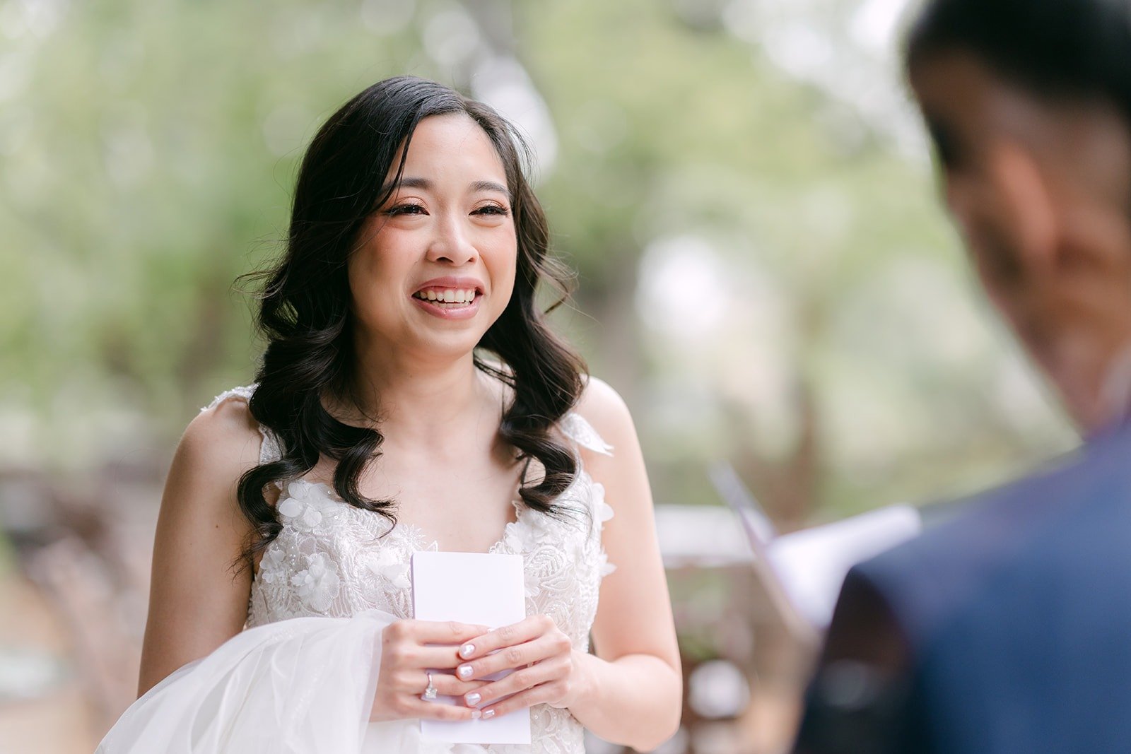 Natalie reading her private vows to Mark on the patio