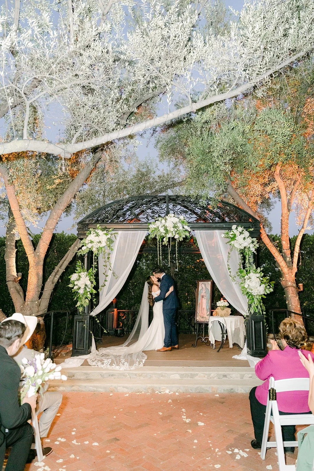 A wide view of the ceremony under the trees at Padua Hills Theatre